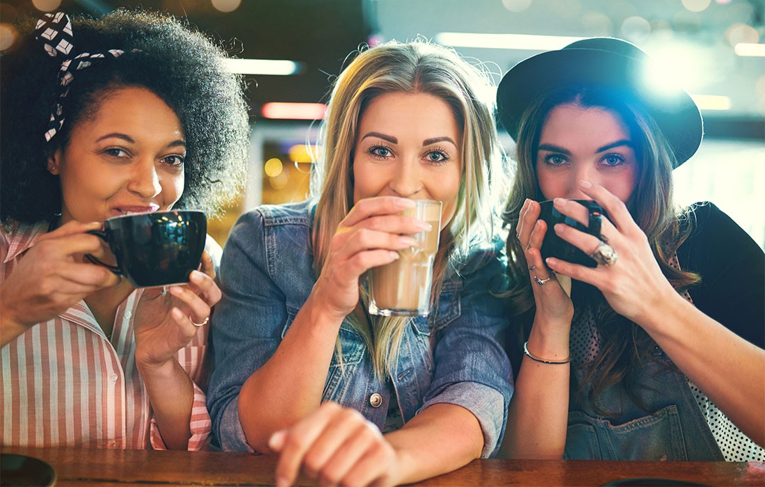 Young women sipping coffee Young women sipping coffee